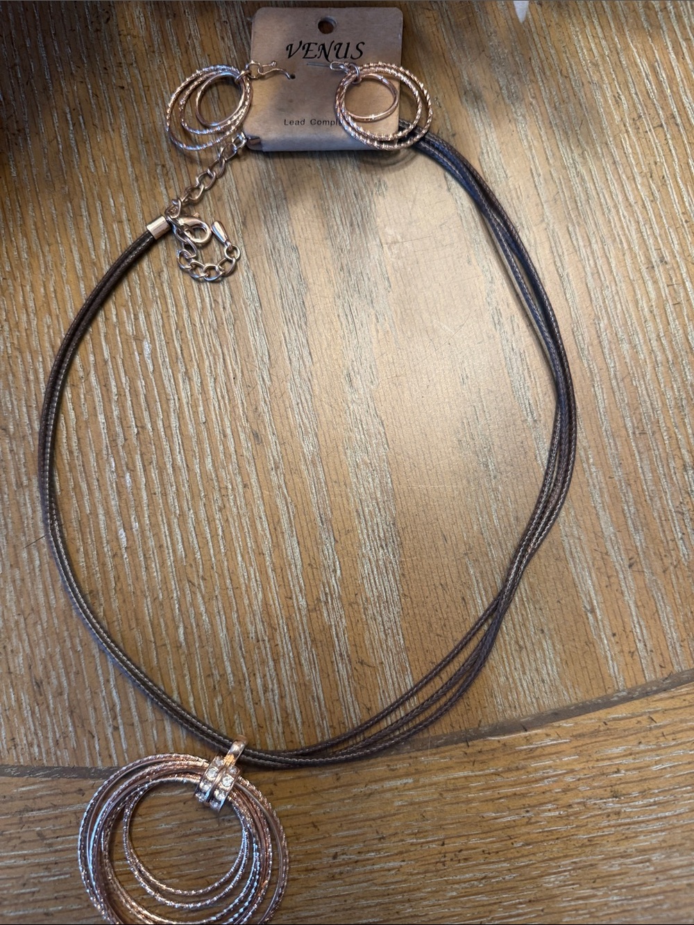 VENUS Rose Gold Layered Ring Pendant Necklace on Brown Cord and earrings
